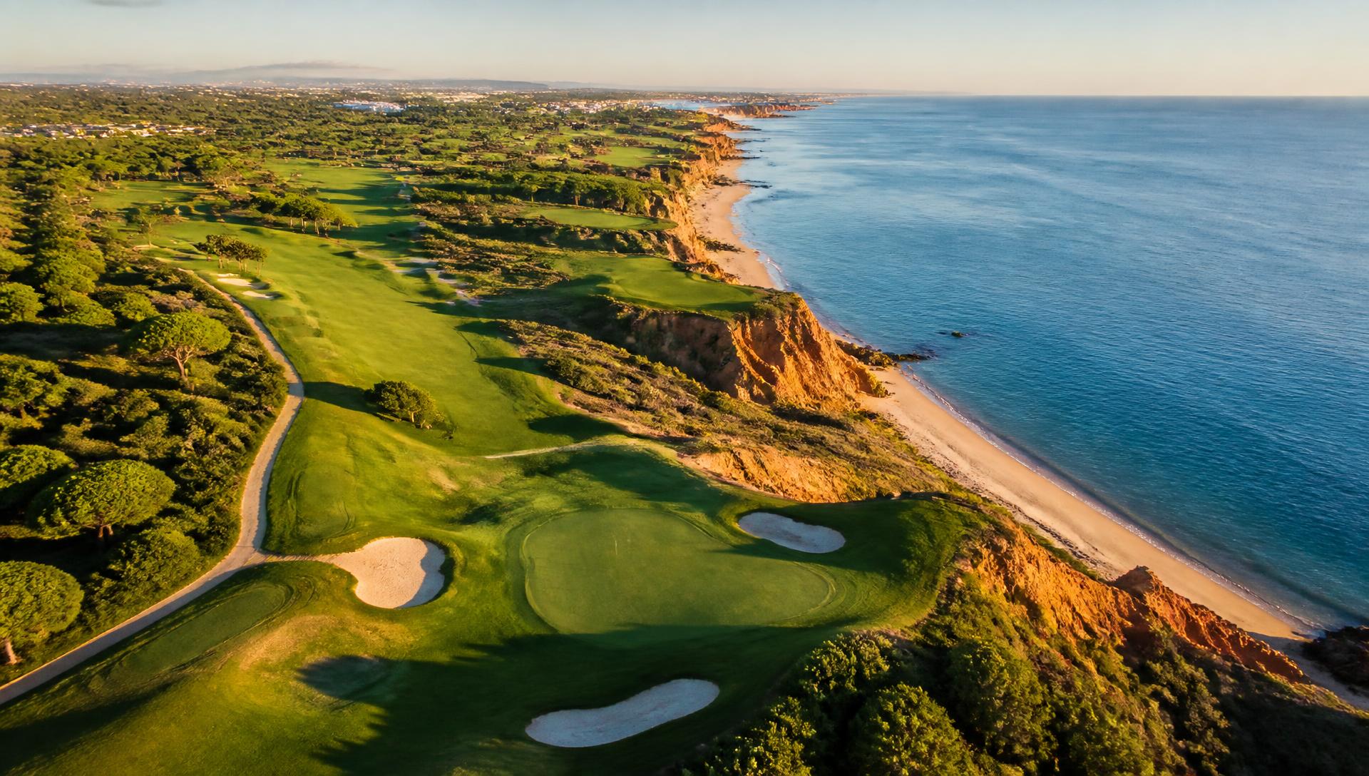 Championship golf course on the Algarve coastline at golden hour